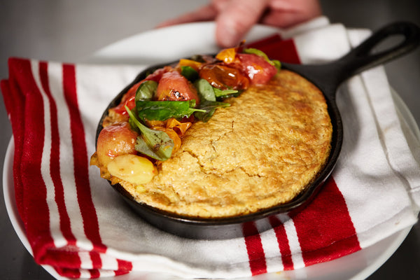 Hatch Chili Corn Pudding with Charred Cherry Tomatoes and Microgreens